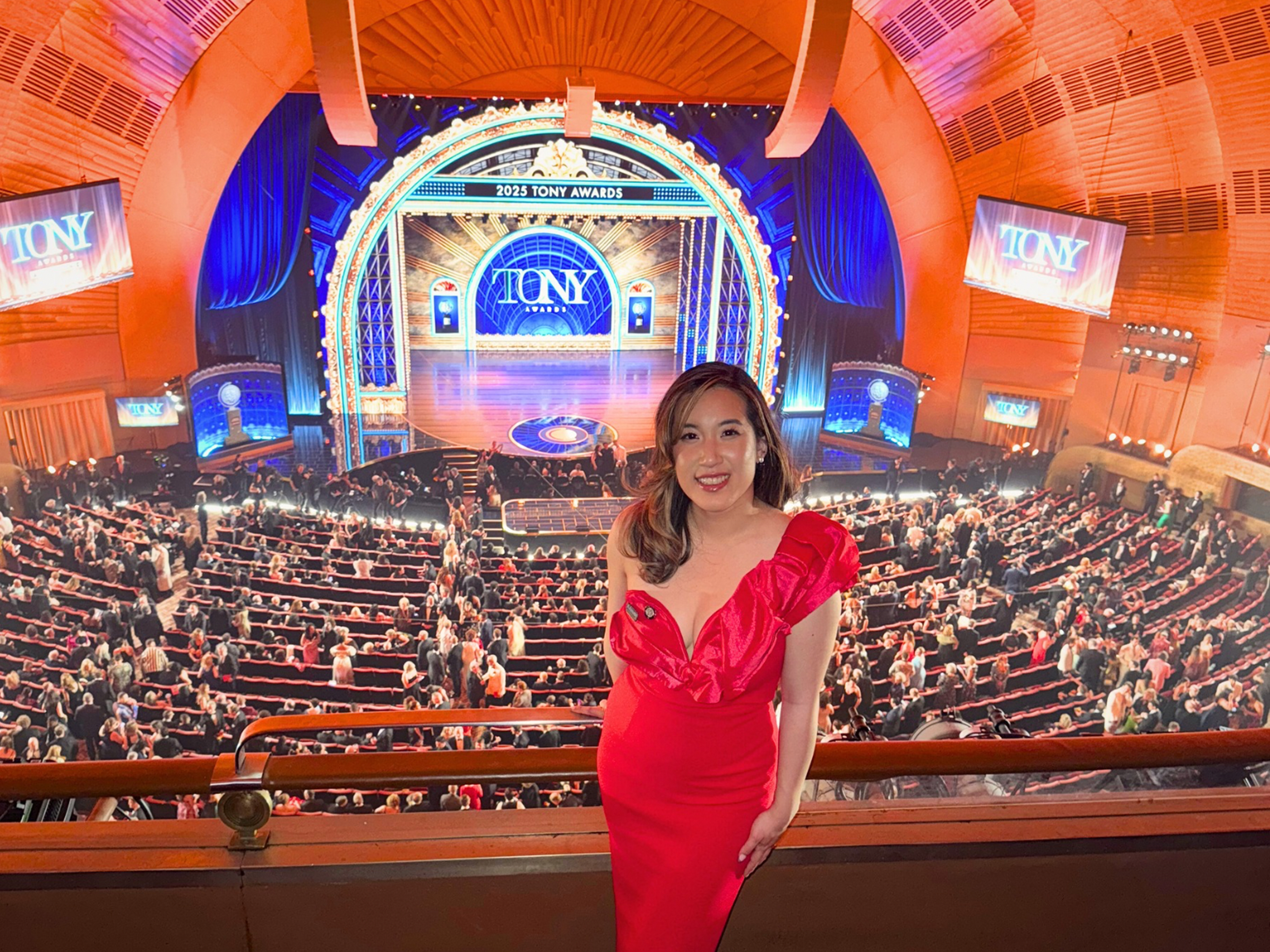 woman in red dress at tony awards